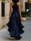 FJØRNA Midnight Elegance satin halter ruffle gown displayed on a hanger with flowing fabric and ruffle details.