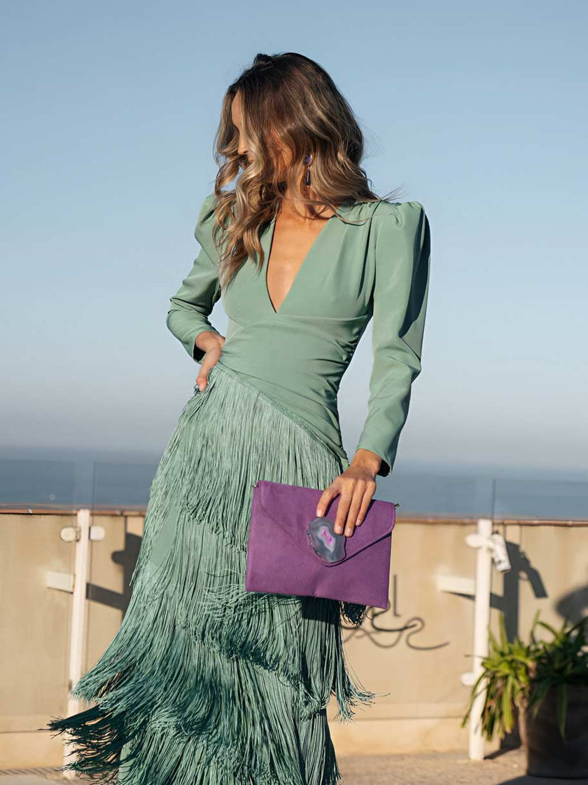 FJØRNA elegant women's V-neck dress with fringe details, stylish and flowing for sophisticated occasions.