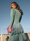 FJØRNA elegant women's v-neck fringe dress with flowing fabric and stylish design, perfect for special occasions and evening wear.
