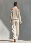 Women’s beige linen-blend high-waisted wide-leg trousers with pockets, by FJØRNA, featuring a relaxed fit and stylish design.