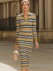 FJØRNA retro chevron print polo collar knit midi dress displayed on a hanger, showcasing its stylish pattern and classic design.