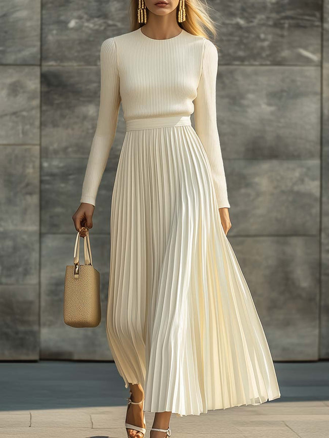 Cream satin pleated maxi dress by FJØRNA featuring flowy fabric and elegant pleats, perfect for casual or special occasions.