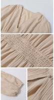 White Spring Chic dress by FJØRNA, lightweight and stylish, featuring a flowy design perfect for warm weather.