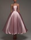 FJØRNA pink satin midi dress for women, strapless A-line style with shawl and strappy details, elegant evening wear for women