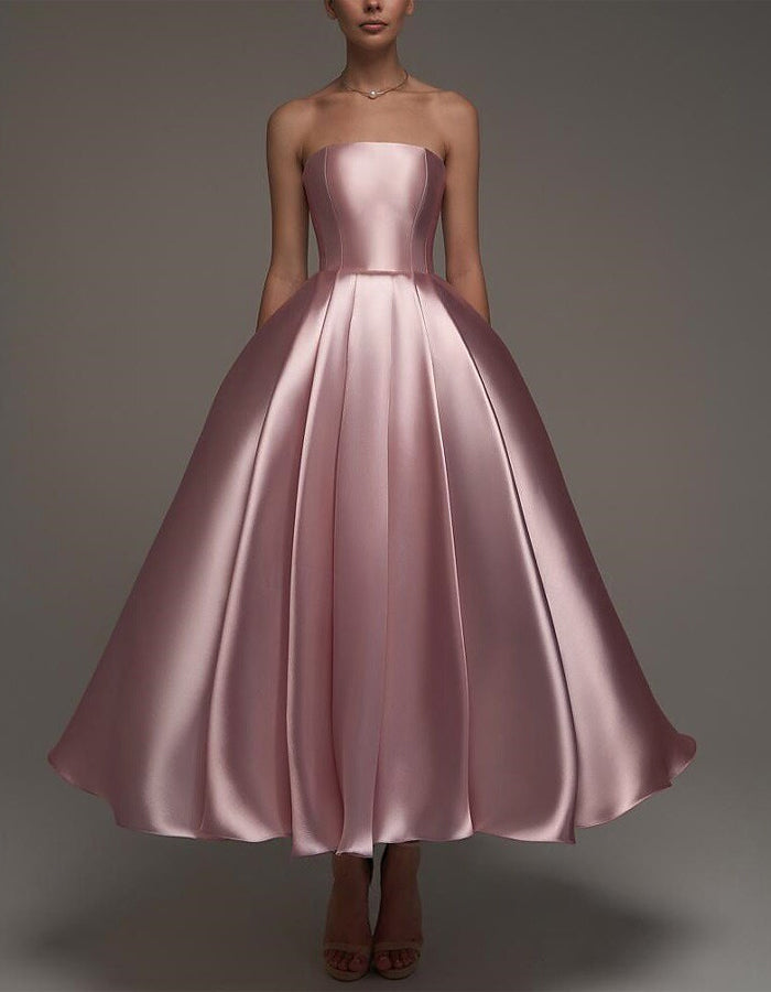 FJØRNA pink satin midi dress for women, strapless A-line style with shawl and strappy details, elegant evening wear for women