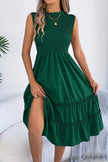 FJØRNA solid color sleeveless tucked patchwork casual midi dress displayed on a model, showcasing its relaxed fit and stylish design.