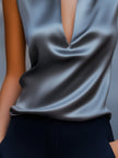Gray satin plunge neck top for women by FJØRNA, featuring a sleek design and stylish fit, perfect for elegant casual wear.