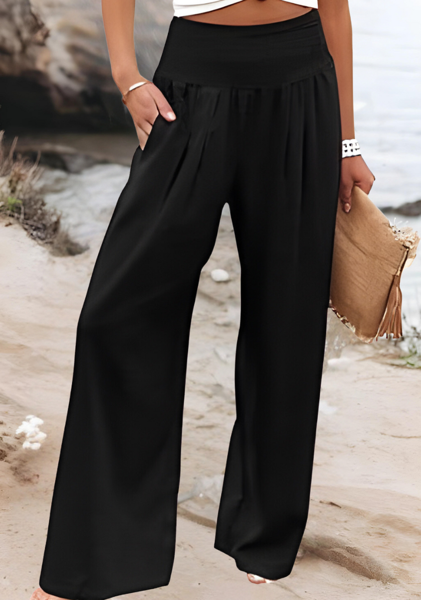FJØRNA lightweight summer women's trousers with wide-leg, flowy, breathable fabric, perfect for warm weather and casual wear.