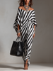 FJØRNA Statement Monochrome Stripe Asymmetric Maxi Dress in white, featuring bold stripe pattern and flowing silhouette.
