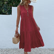 FJØRNA summer casual wedding dress with lightweight fabric, sleeveless design, and elegant flowy silhouette for warm-weather occasions.