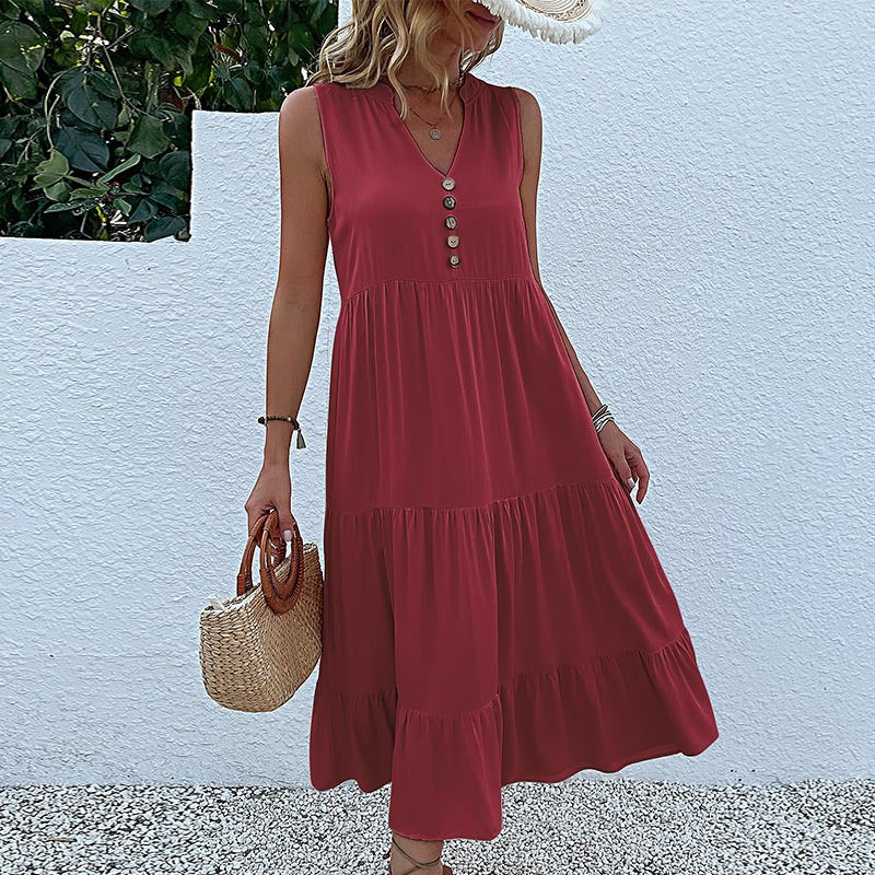 FJØRNA summer casual wedding dress with lightweight fabric, sleeveless design, and elegant flowy silhouette for warm-weather occasions.