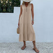 FJØRNA casual summer wedding dress with sleeveless design, flowy fabric, and elegant silhouette, perfect for outdoor celebrations.