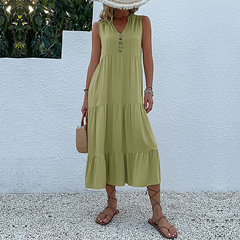 Light beige casual wedding dress by FJØRNA with flowy fabric, sleeveless design, and elegant summer style.