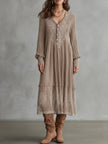 FJØRNA Whispered Snow Knit Maxi Dress featuring a cozy, white knit fabric and flowing silhouette, perfect for stylish winter wear.