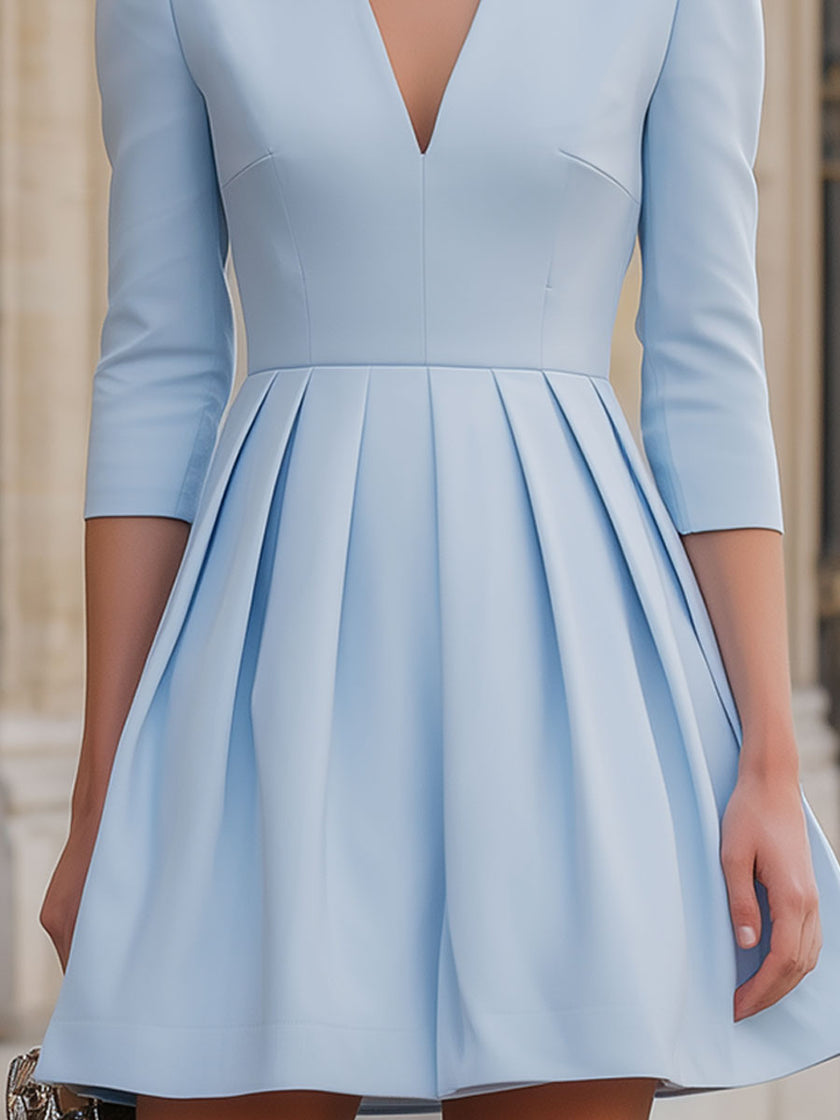 FJØRNA elegant powder blue pleated fit-and-flare dress for women, showcasing a flowy silhouette and stylish design.