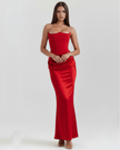 FJØRNA women's strapless corset maxi dress with ruched detail, featuring a fitted bodice and flowing skirt in a vibrant topaz color.