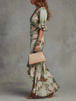 FJØRNA women's V-neck maxi dress with flowing fabric and sleeveless design, perfect for elegant summer or casual wear.