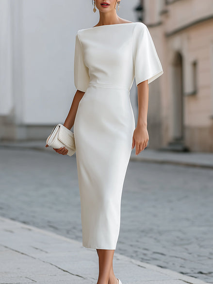 FJØRNA boat neck short sleeve tailored midi dress displayed on a hanger, showcasing its elegant design and classic silhouette.
