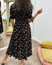 FJØRNA women's summer mini dress with polka dots and a V-neck, casual and stylish for warm weather.