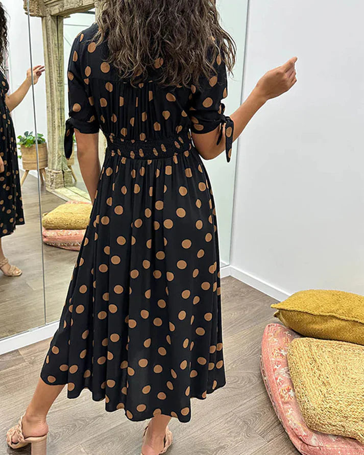 FJØRNA women's summer mini dress with polka dots and a V-neck, casual and stylish for warm weather.