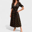 FJØRNA summer mini dress for women featuring a polka dot pattern and V-neck design, perfect for warm weather wear.