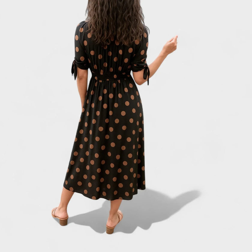 FJØRNA women's summer mini dress with polka dots and V-neck, lightweight and stylish for warm weather.