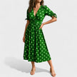 FJØRNA women's summer mini dress with polka dots and V-neck, lightweight and stylish for warm weather.