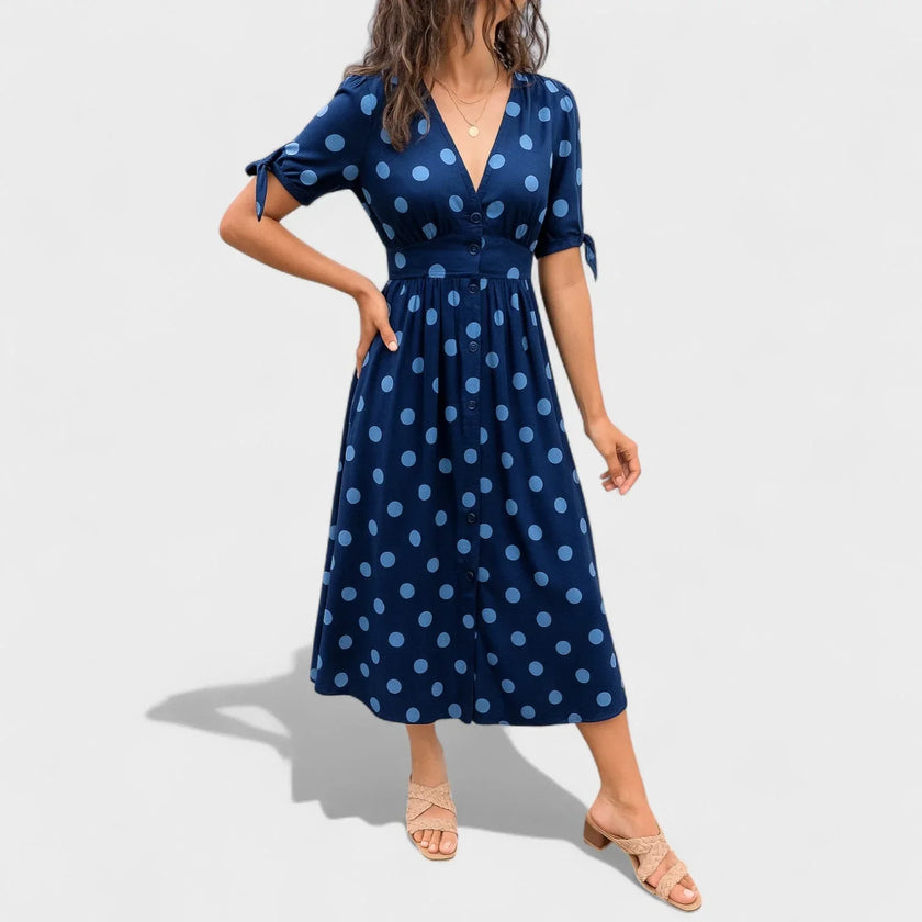 FJØRNA women's summer mini dress with polka dots and V-neck, lightweight and stylish for warm weather wear.
