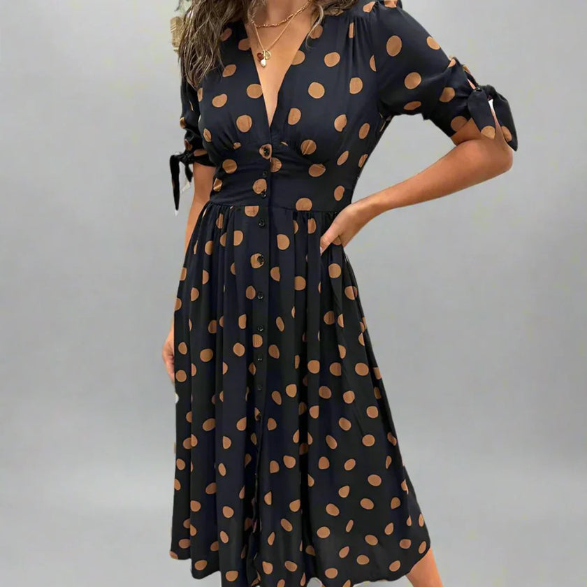FJØRNA summer mini dress for women featuring a polka dot pattern and V-neck design, perfect for warm weather.