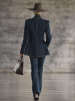 FJØRNA navy topstitched denim jacket for women, featuring classic design, front pockets, and button closure.