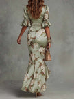 FJØRNA women's V-neck maxi dress featuring a flowy silhouette and elegant design, perfect for casual or formal occasions.