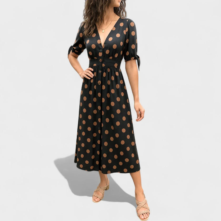 FJØRNA summer mini dress for women featuring a polka dot pattern and a V-neck design, perfect for warm-weather styling.