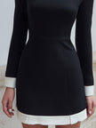 Black FJØRNA lace mini dress with contrast trim, long sleeves, stylish and elegant for evening wear.