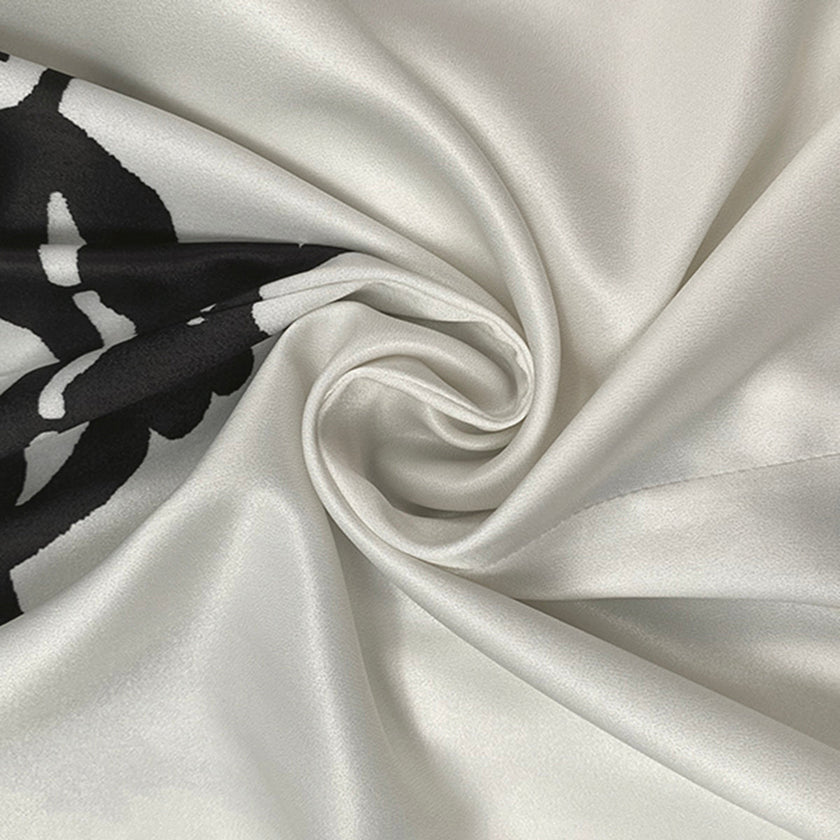 FJØRNA white midi dress with half sleeves, flower print, tied waist, and v-neck design, perfect for casual or summer wear.