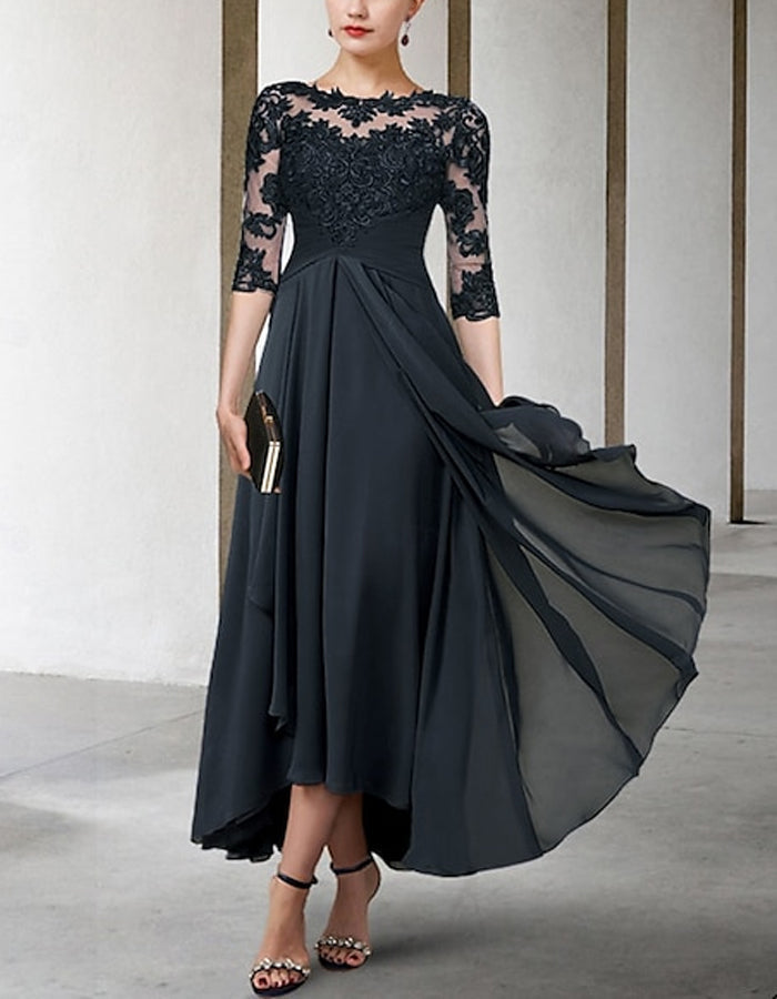 FJØRNA chiffon midi dress for women, A-line style with three-quarter sleeves, flowing fabric and elegant design.