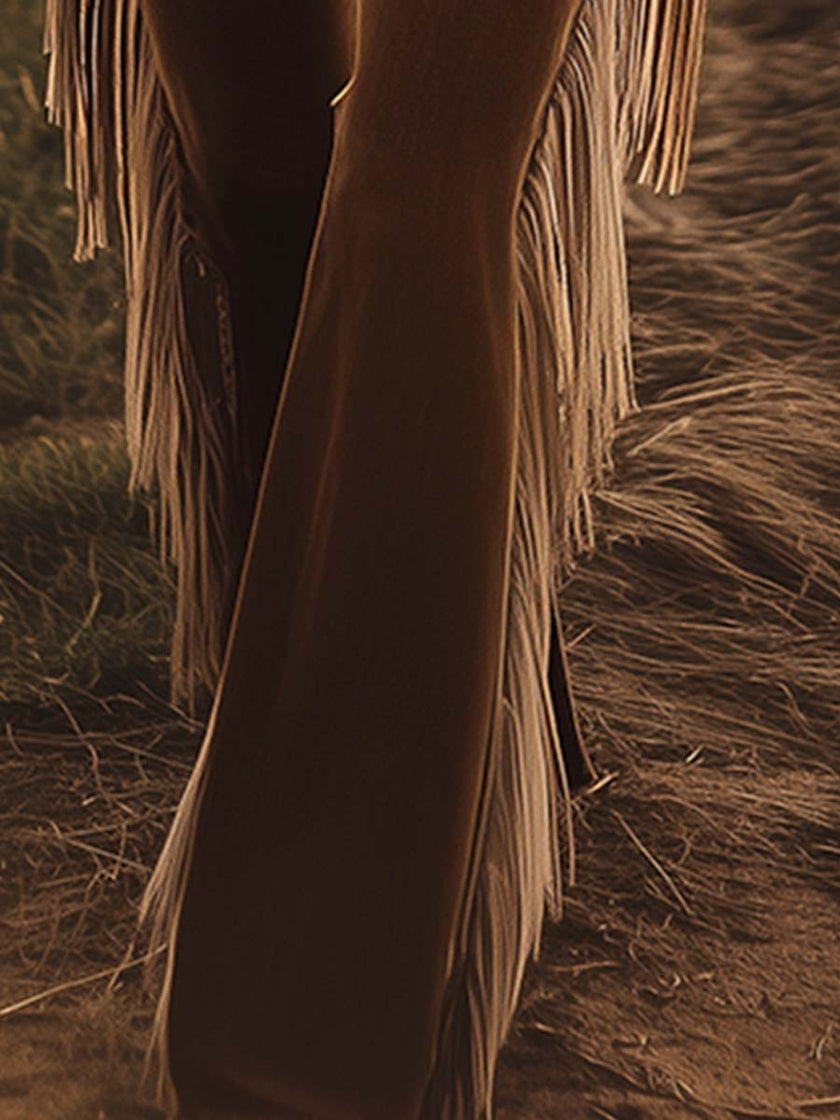 Brown Western fringe flared jeans for women by FJØRNA, featuring a stylish flare and fringe details in a casual pants style.