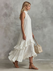 FJØRNA white sleeveless midi dress with ruffled cotton-linen fabric, featuring a retro-elegant style perfect for women.