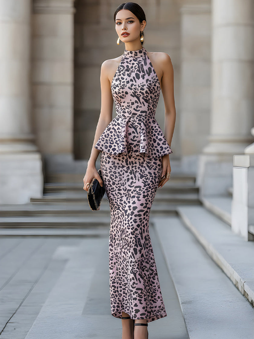 FJØRNA halter peplum midi dress for women with sculpted waist and elegant silhouette, displayed on a model.