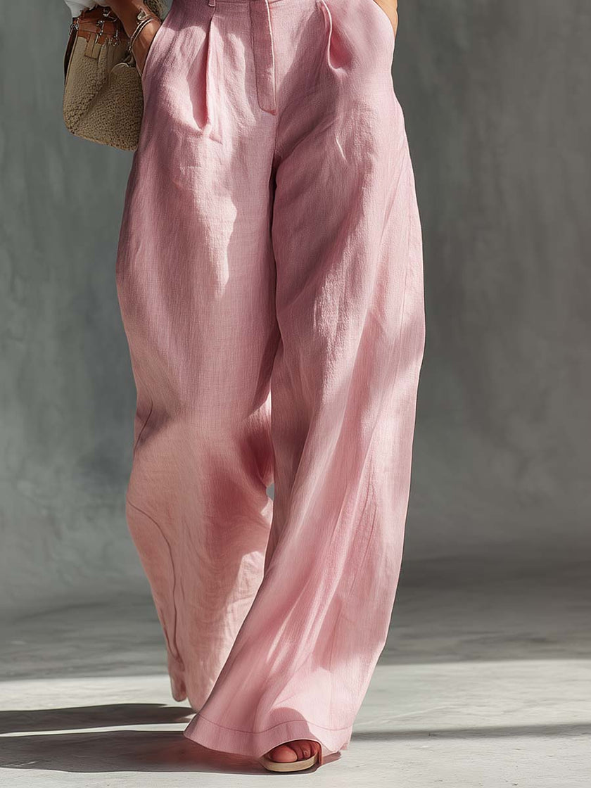 Pink cotton linen wide-leg dungarees for women by FJØRNA, featuring relaxed fit overalls with adjustable straps and wide-leg design.