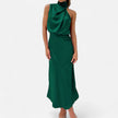 FJØRNA draped sleeveless halter maxi dress in flowing fabric, displayed on a model with a high neckline and elegant silhouette.