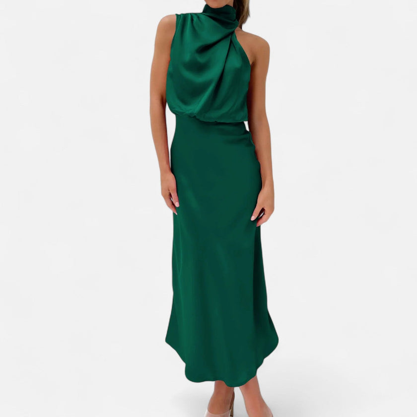 FJØRNA draped sleeveless halter maxi dress in flowing fabric, displayed on a model with a high neckline and elegant silhouette.
