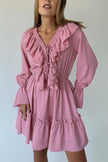 FJØRNA solid color V-neck ruffled ruched long-sleeved vacation mini dress, casual wedding dress style, shown on model.