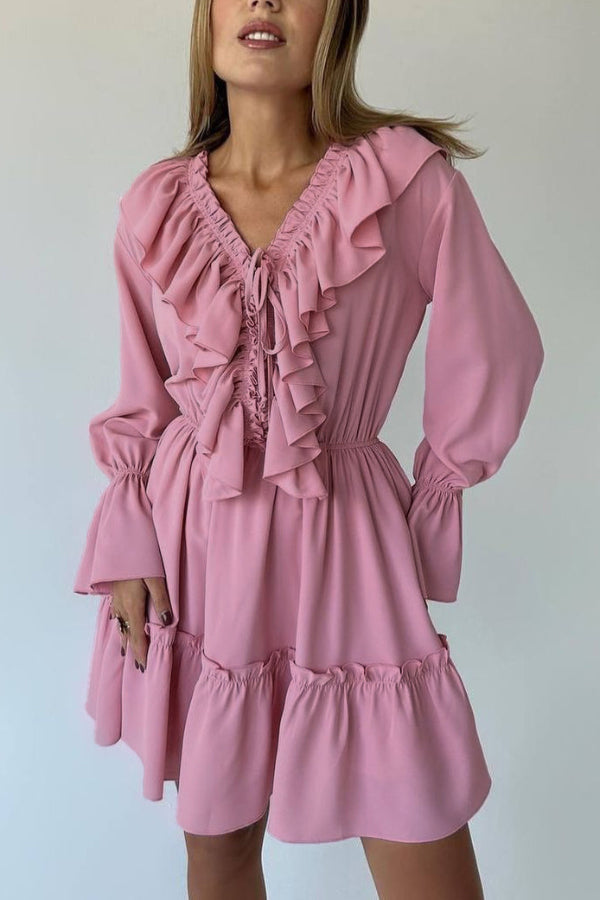 FJØRNA solid color V-neck ruffled ruched long-sleeved vacation mini dress, casual wedding dress style, shown on model.
