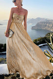 FJØRNA Celeste women's strapless A-line evening gown with pleated metallic fabric, elegant and stylish for formal occasions.