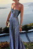 FJØRNA Celeste women's strapless A-line evening gown with pleated metallic fabric, elegant and stylish for formal occasions.