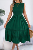 FJØRNA solid color sleeveless tucked patchwork casual midi dress displayed on a model, showcasing its relaxed fit and stylish design.