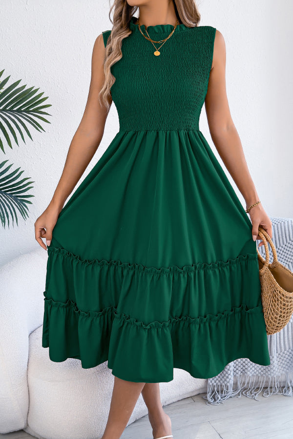 FJØRNA solid color sleeveless tucked patchwork casual midi dress displayed on a model, showcasing its relaxed fit and stylish design.