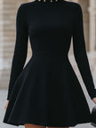 FJØRNA black studded neckline dress for women, elegant sleeveless black dress with a stylish studded neckline detail.