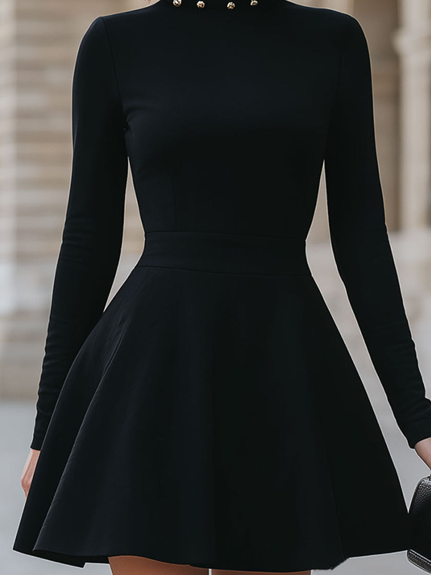FJØRNA black studded neckline dress for women, elegant sleeveless black dress with a stylish studded neckline detail.