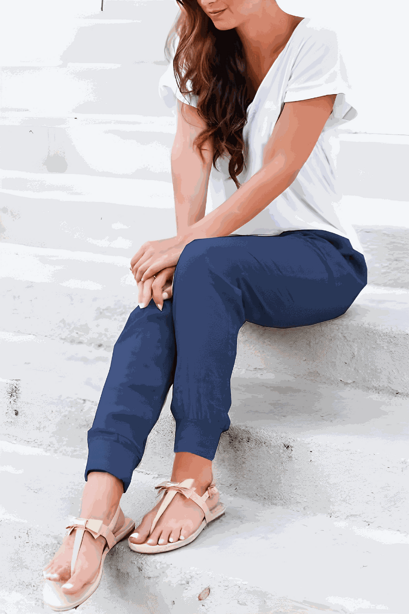 FJØRNA Tara women's drawstring jogger pants with elastic ankle cuffs, soft fabric and relaxed fit, displayed on a model.